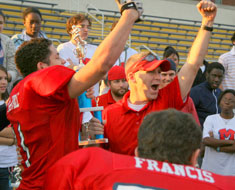 Image: Football players cheer with Mark