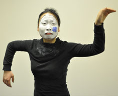 Image: MSSD student MeiLi Robbins mimes a broken flower during her performance in the QuestFest Community Showcase. (Photo: Goodman/VanRiper)