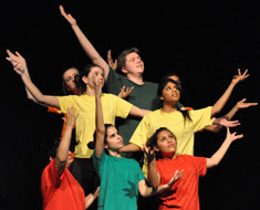 Image: MSSD student Wendy Brehm (wearing turquoise shirt) performs in 'The Seeds,' part of the QuestFest Community Showcase. (Photo: Goodman/VanRiper)