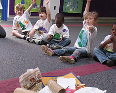 Image: Students in a classroom with recycling items on floor