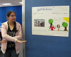 Image: Johanna Cruz illustrates in ASL the English idiom, "spilled the beans."