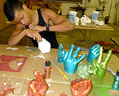 Image: MSSD Davante Kirk works on one of the handshape sculptures.