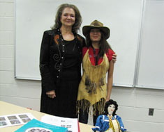 Image: The MSSD Diversity Club invited M SSD student enhancement educator Judy Stout (left) to give a talk on November 17 about her Lumbee Indian heritage. After the presentation MSSD student Hazel Fajardo tried on Stout’s Lumbee-designed leather hat and deerskin vest with feathers.