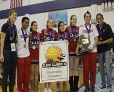 Image: Pictured here, the MSSD cheerleading squad (left to right): Coach Emilia Nowalski, Brandon Johnson, Yazmin Palmer, Katryna Baldiviez, Sara Selzer, Kelly Doleac, Seth Washington, and Coach Cesar Ayala.