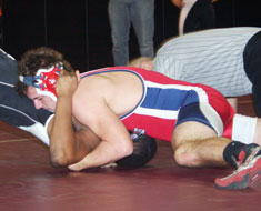 Image: MSSD wrestler Albert Blake pins his opponent from the CSD-Fremont at the National Deaf Prep Duals Tournament held January 22-23. (Photo: Jolynn Ferguson)