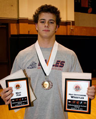 Image: Albert Blake finished with a First Place medal along with Most Pins and Most Outstanding Wrestler awards. (Photo: Jolynn Ferguson)