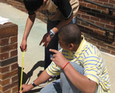 Image: KDES students measure slope rise on ramp. (Photo: Susan Flanigan)