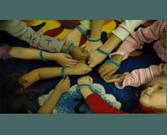 Image: KDES Kindergarteners display "I am Somebody" bracelets which they received after a read-aloud of the  Berenstain Bears story, "Bullying." (Photo: Susan Flanigan)