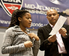 Image: Sohnae McCray performs her winning essay from the Arthur Ashe Essay and Art Contest for the USTA division meeting on November 3.