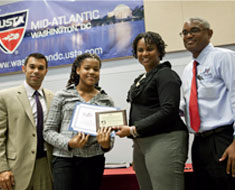 Image: McCray (second from left) poses with Dan Limbago, USTA National NJTL Manager, Kelly Jackson, President USTA DC, and  Ronnie Goodall, UUSTA DC Executive Director at the awards luncheon.
 