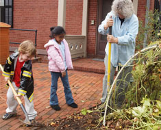 Image: KDES students work at the sweet potato harvest at the House One garden on November 21 with Trudy Haselhuhn from Gallaudet. (Photo: KDES student photographer)