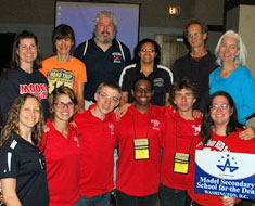 Image: Proud MSSD parents stand behind the MSSD team and coaches after the final match on Saturday.