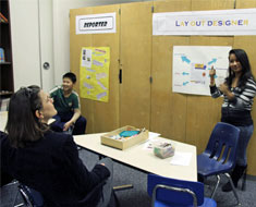 Image: The staff of the Kendall Academy Newsletter rotates their roles so that each student can experience different roles in publishing. At the expo, students described the functions of each department in the newsletter.