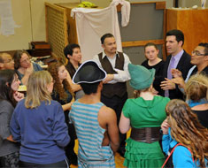 Image: The cast and crew of Peter Pan and Wendy gathered around playwright Doug Rand (back row, center) at the end of the performance on November 9. Rand complimented the cast on the high production value of the show. (Photo: Jessica Jastrzebski)