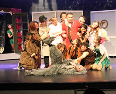 Image: The Darling Family welcomes in the Lost Boys while Peter Pan looks wistfully on. (Photo: Susan Flanigan)
