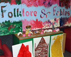Image: Masks and scene props were made by the students for “The Three Little Pigs” skit.