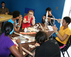 Image: Members of the Van Lions team build model rockets.