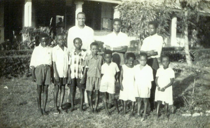 Foster poses with 10 Deaf pupils.