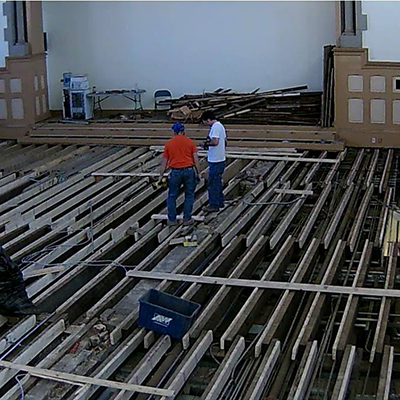 The flooring at Chapel hall has been completely removed. the slats you see here are used to build a new floor