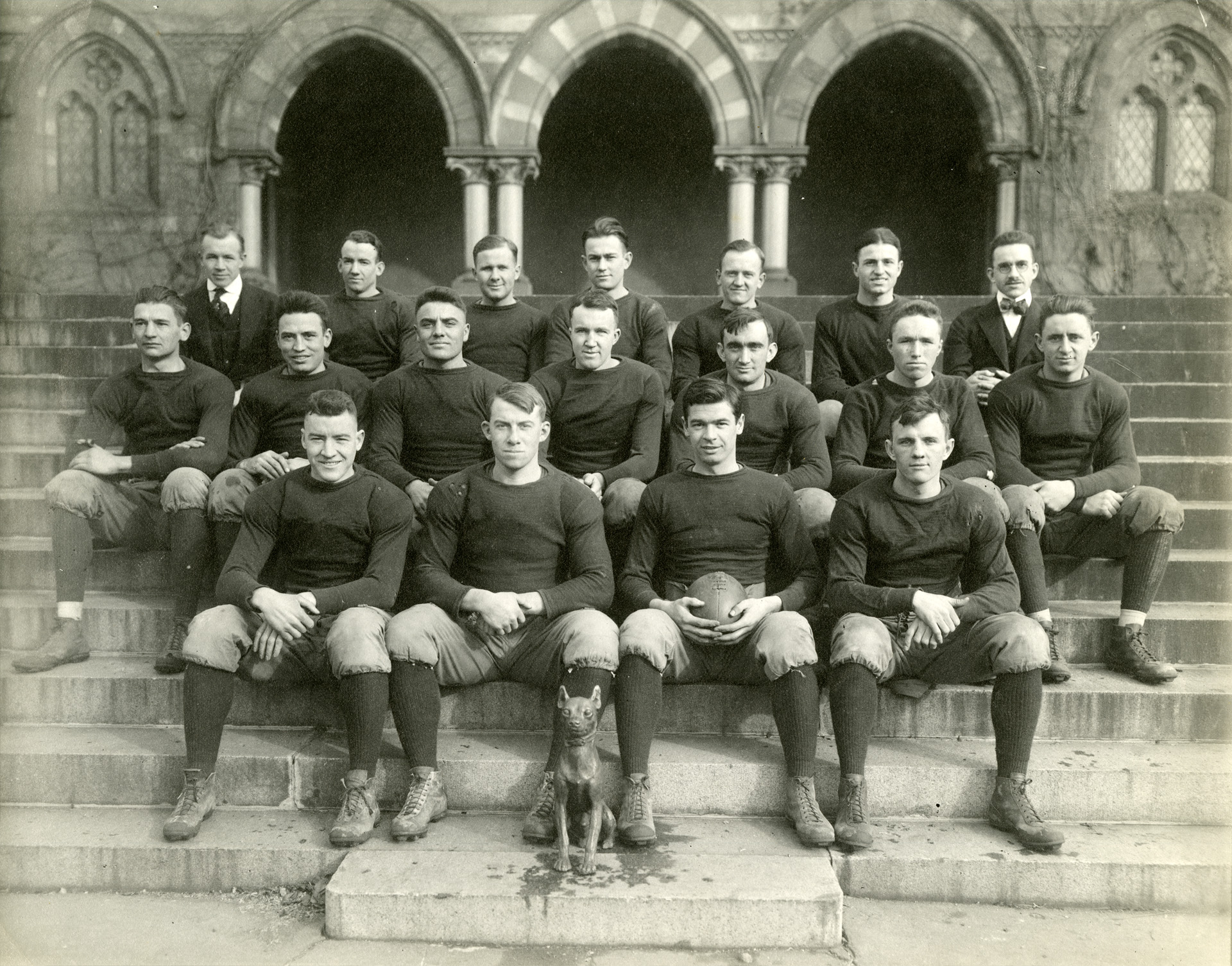 Blk/white photo of Football players in group in front of Chapel Hall