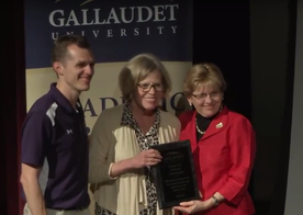 Astrid Amann Goodstein receiving her Academic Bowl Hall of Fame award from President Cordano in 2016
