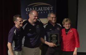 Bob Weinstock receiving his Academic Bowl Hall of Fame award from President Cordano in 2016