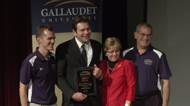 David Uzzell receiving his Academic Bowl Hall of Fame award from President Cordano in 2016