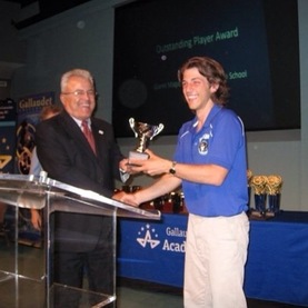 Gianni Maganelli receiving his Academic Bowl Hall of Fame award from President Davilla in 2014