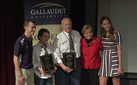 Mary Kovatch and Chuck Daube receiving their Academic Bowl Hall of Fame awards from President Cordano in 2016