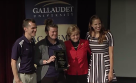 Pia Marie Paulone receiving her Academic Bowl Hall of Fame award from President Cordano in 2016